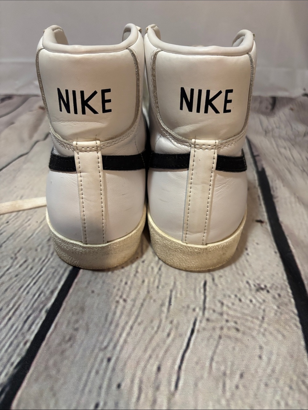 Nike White High-Top Sneakers with Black Stripe